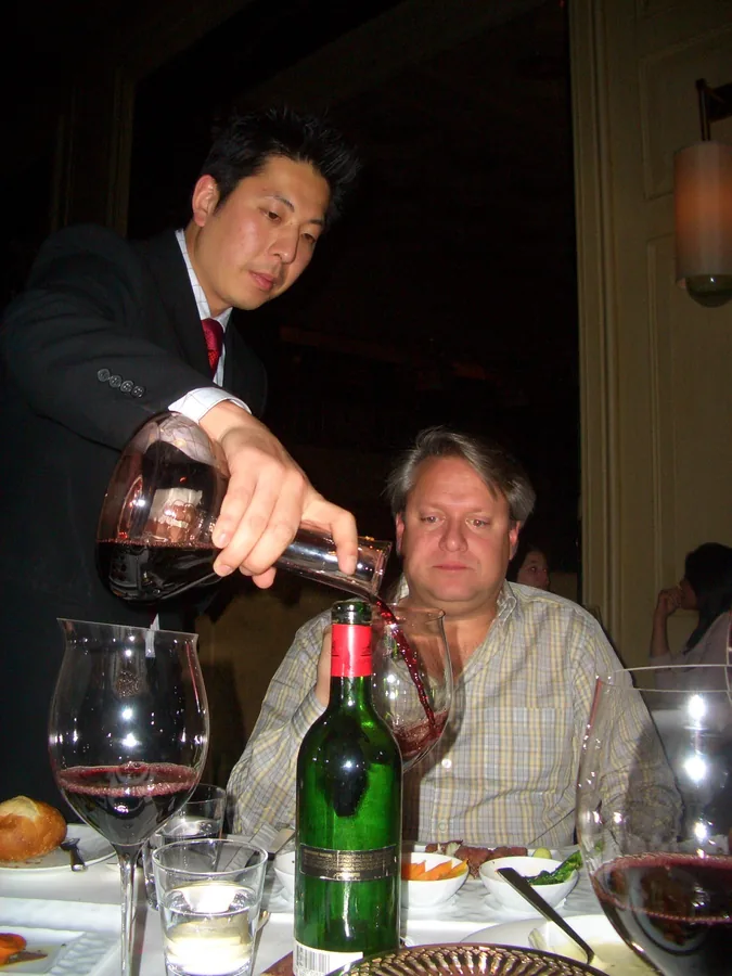 Sommelier preparing wine for pairing white wine and fish