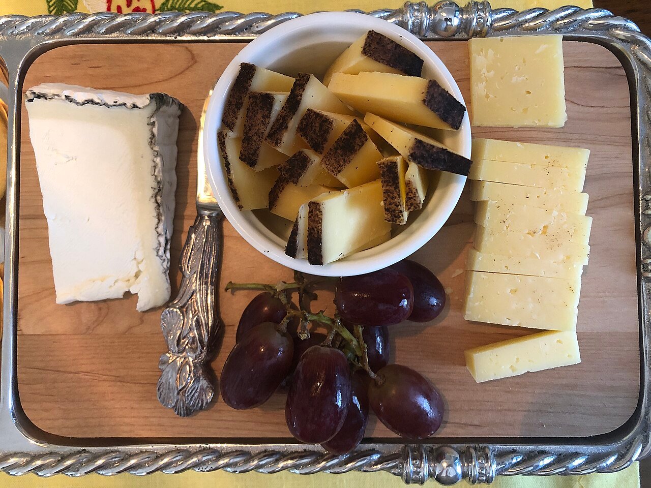 Heavy cheese platter with dairy fats that coat the palate during delicate wine tastings