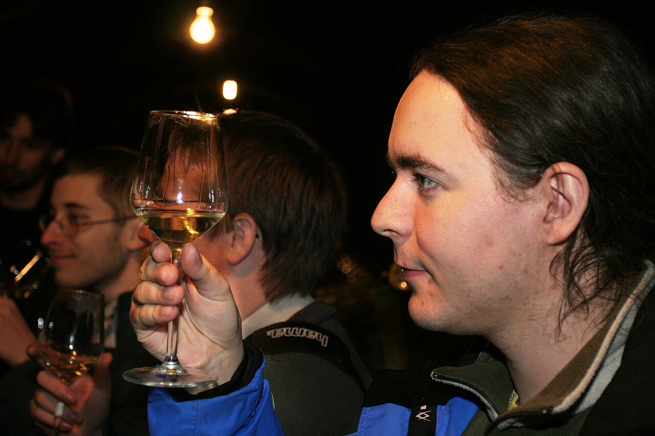 Professional wine tasting evaluating acidity and texture for wine and trout pairing